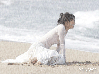 woman crying under the rain on the beach