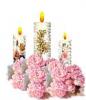 three candles with pink flowers