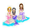 3 Mermaid friends drying out in the sun, on rocks
