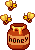 honey with bees flying around