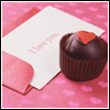 Yummy and cute cup cake with a love card